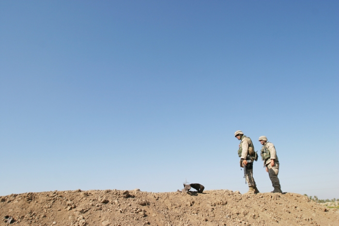 Marines from 1/2 Bravo Co., 2nd Platoon, checking for IEDs during a routine patrol, Babil Province, Iraq, August 20, 2004
